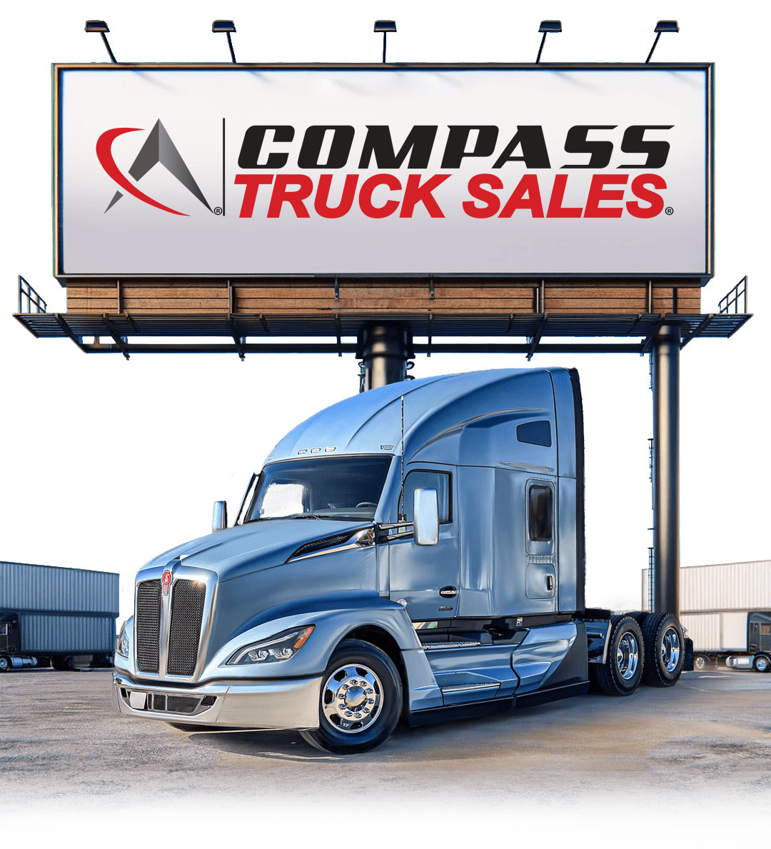 A truck with a Compass Truck Sales billboard behind it.